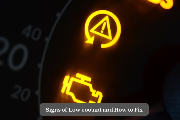 dashboard of car showing check engine light due to low coolant